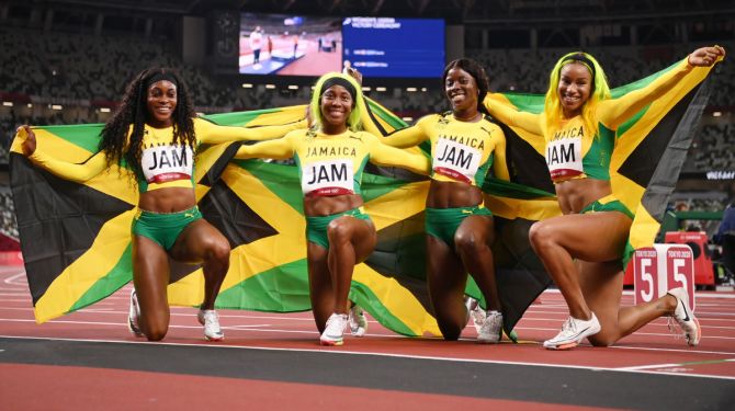 Jamaica's Briana Williams, Elaine Thompson-Herah, Shelly-Ann Fraser-Pryce and Shericka Jackson celebrate winning the gold medal in the women's 4 x 100m Relay Final.