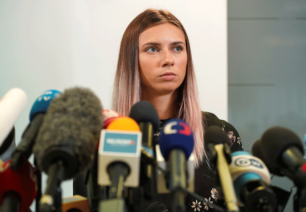 Belarusian sprinter Krystsina Tsimanouskaya, who left the Olympic Games in Tokyo and seeks asylum in Poland, at a news conference in Warsaw, Poland on Thursday. Tsimanouskaya, who told Reuters the IOC had acted quickly when she was taken to the airport and remained in contact with her, said her teammates had not been in touch, most likely because they feared repercussions. 