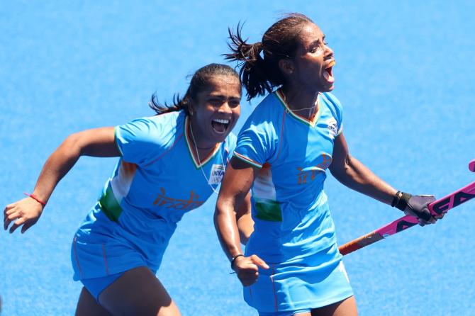 Vandana Katariya celebrates scoring India's third goal with Neha Goyal during the Olympics women's Bronze medal match against Great Britain, at Oi Hockey Stadium in Tokyo, on Friday. 