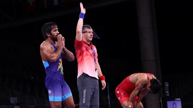 India's Bajrang Punia reacts after defeating Kazakhstan Daulet Niyazbekov in the Olympics men's 65kg Freeystyle wrestling bronze medal match