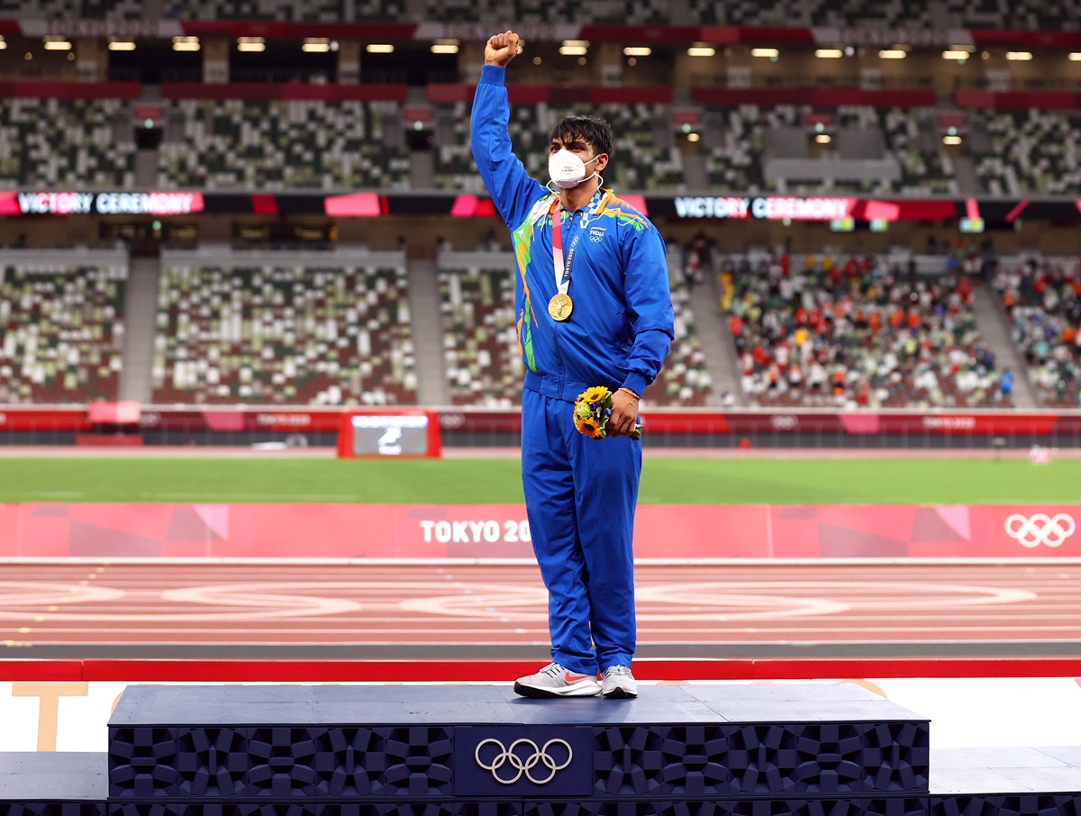 India's Neeraj Chopra celebrates on the podium after the medal ceremony for the Olympics men's Javelin Throw, at Olympic Stadium, in Tokyo, on Saturday.