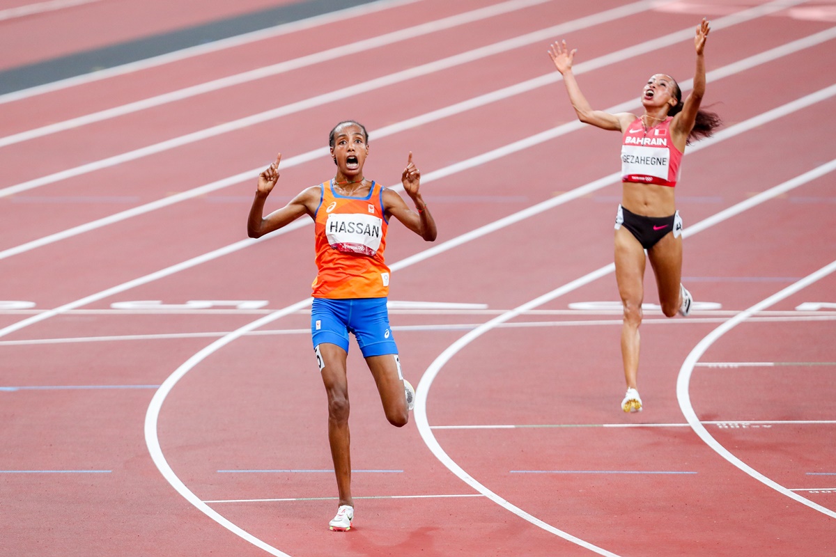 Sifan Hassan of the Netherlands finishes first in the Olympics women's 10,000 metres final, aheaad of Bahrain's Kalkidan Gezahegne, at the Olympic Stadium in Tokyo, on Saturday.