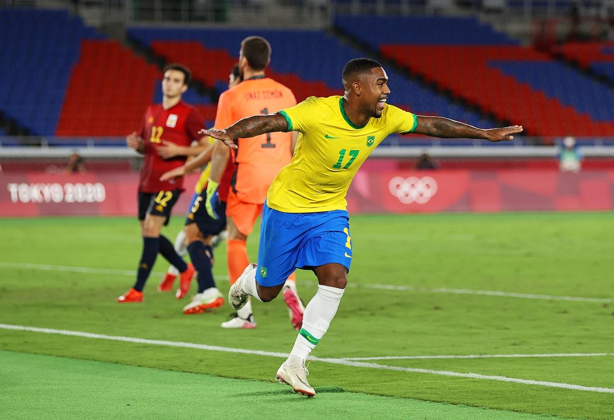 Malcolm celebrates after scoring the match-winner for Brazil