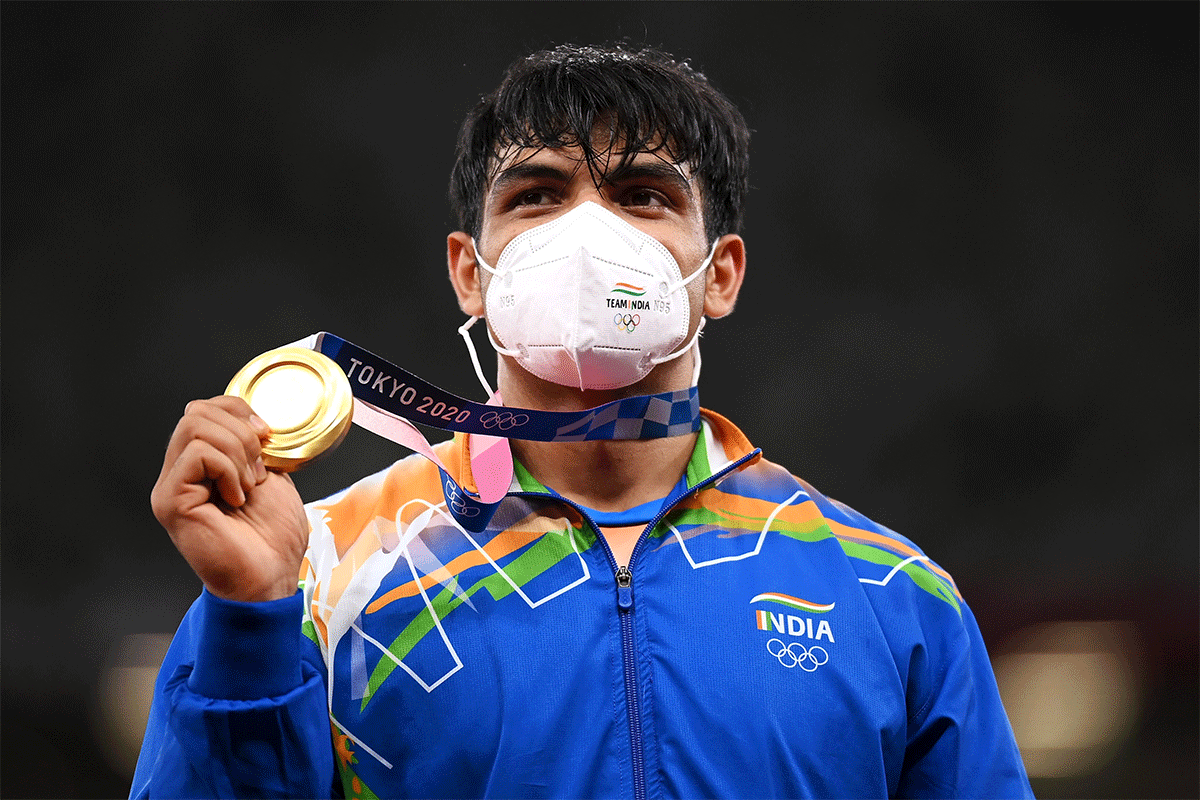 India's Javelin Thrower Neeraj Chopra with his gold medal on the podium at the Tokyo Olympics on Saturday