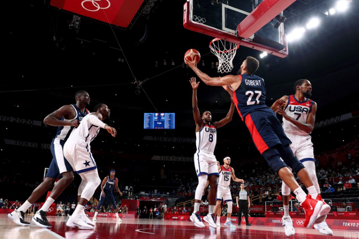 France's Rudy Gobert tries to score as basket 