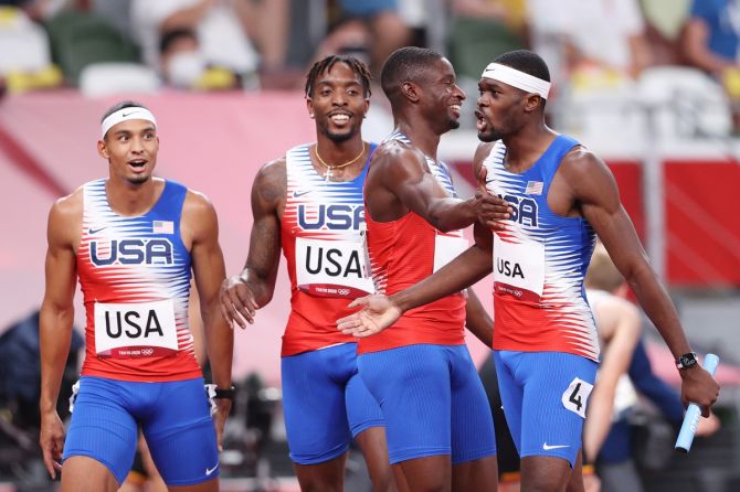 (L-R) Michael Norman, Michael Cherry, Bryce Deadmon and Rai Benjamin of the United States celebrate after winning the gold medal in the men's 4 x 400m Relay final.