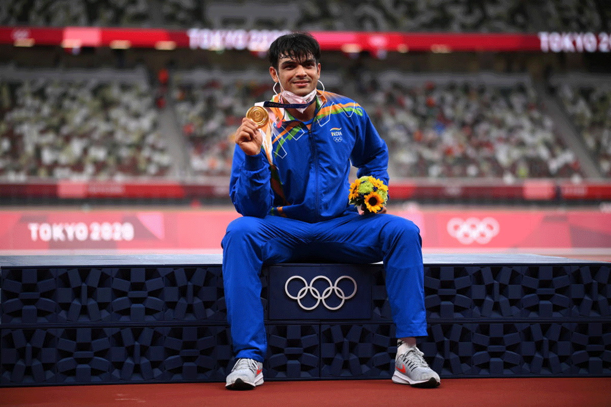 Neeraj Chopra celebrates with gold medal after winning the Javelin Throw Final at the Olympic Games