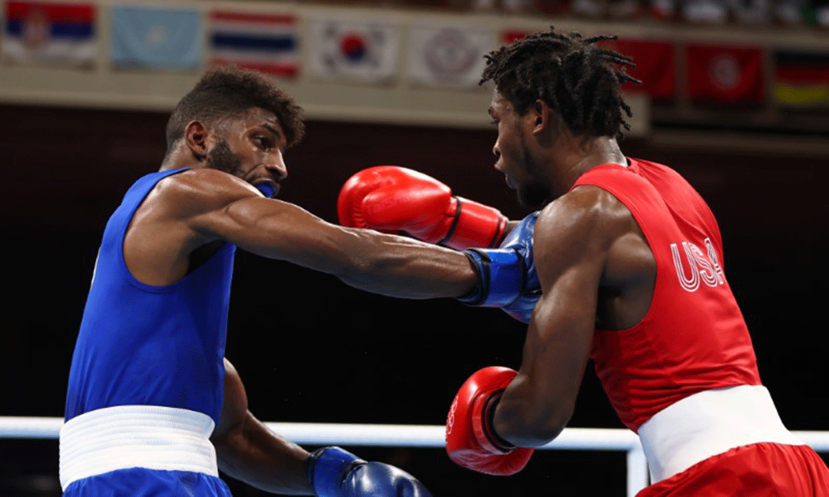 Andy Cruz of Cuba in action against Keyshawn Davis of the United States during the Olympics Boxing Men's Lightweight final in the Kokugikan Arena in Tokyo, on Sunday