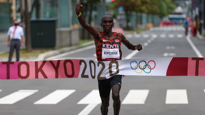 Kenya's Eliud Kipchoge celebrates victory in the Olympics men's Marathon as he crosses the finish line, at Sapporo Odori Park, Sapporo, Japan, on Sunday. 