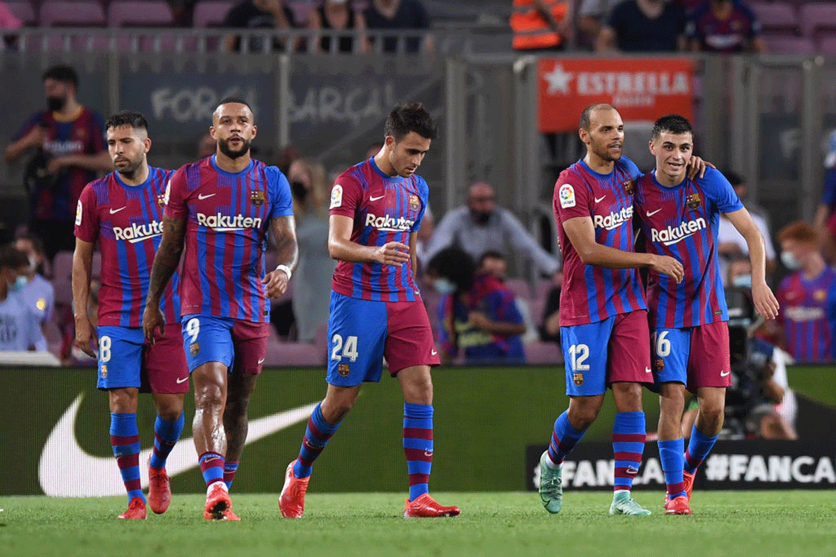 FC Barcelona's Martin Braithwaite celebrates with teammates after scoring their side's second goal against Real Sociedad in their La Liga match at Camp Nou in Barcelona on Sunday