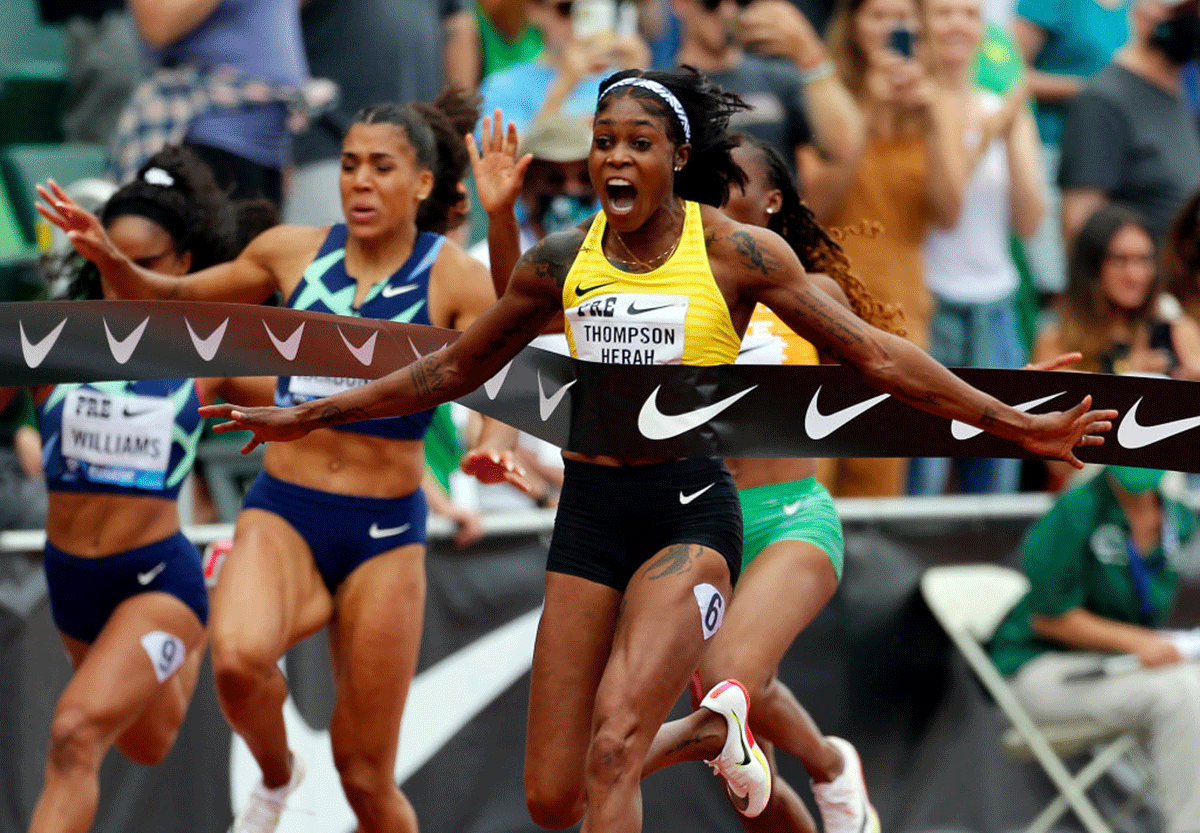 Jamaica's Elaine Thompson-Herah celebrates winning the 100m race during the Wanda Diamond League Prefontaine Classic at Hayward Field in Eugene, Oregon, on Saturday