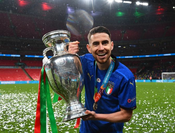 Jorginho celebrates with the Henri Delaunay Trophy following Italy's triumph in the UEFA Euro 2020 Championship final against England, at Wembley stadium, London, on July 11, 2021.