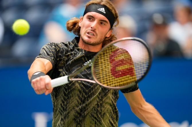 Stefanos Tsitsipas returns to Andy Murray during Tuesday's match at the US Open.
