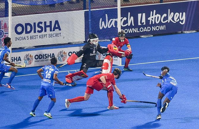 India's Shardanand Tiwari scores from a penalty-corner against Belgium during the men's Junior World Cup hockey quarterfinal, at Kalinga Stadium in Bhubaneswar, on Wednesday.