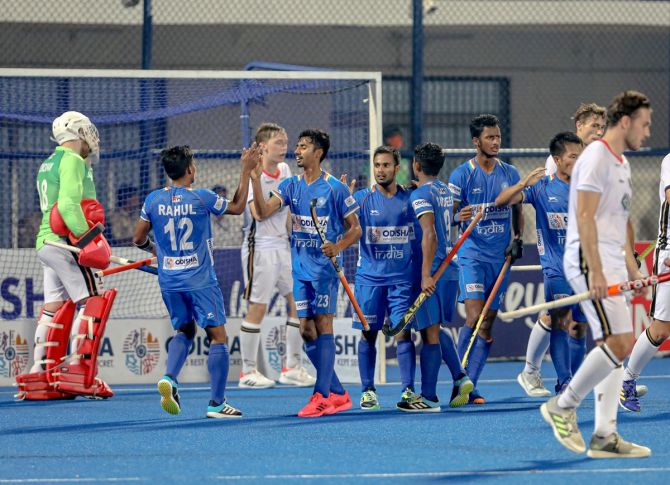 India's players celebrate after pulling a goal back against Germany in the semi-finals. 