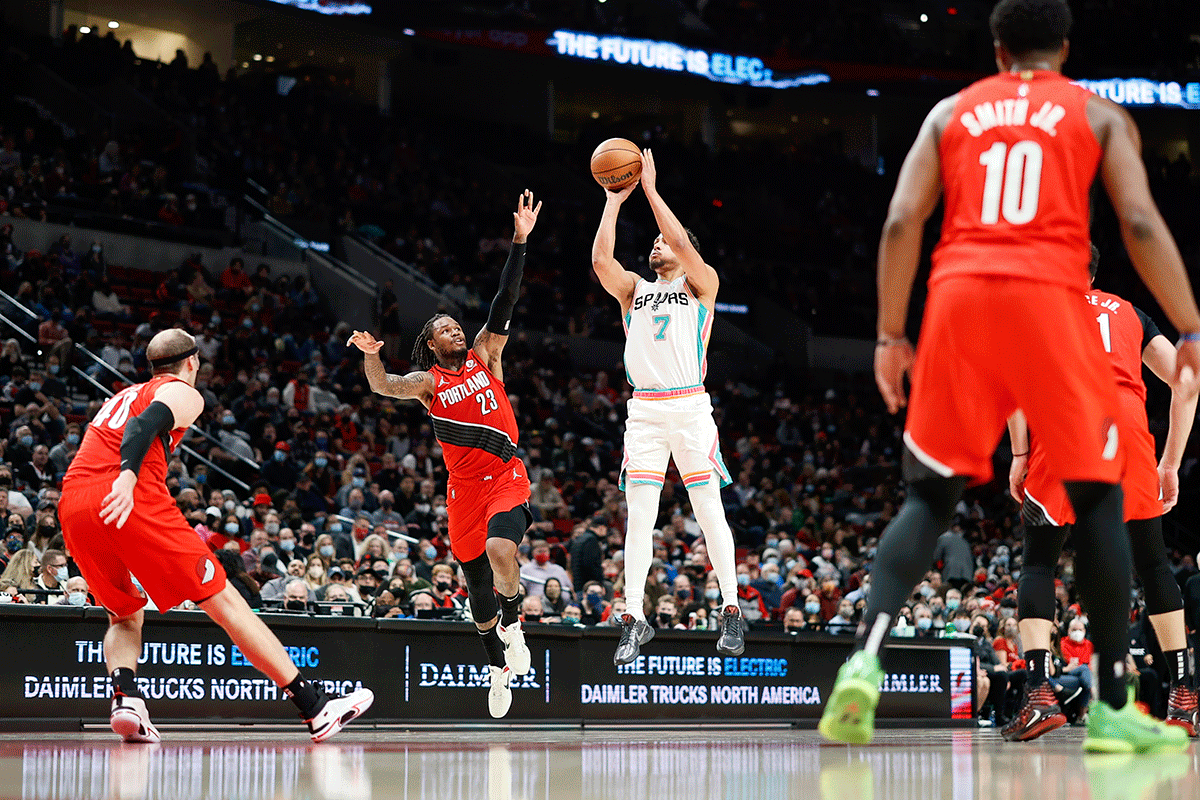 San Antonio Spurs shooting guard Bryn Forbes (7) shoots the ball over Portland Trail Blazers shooting guard Ben McLemore (23) during the second half of their NBA game at Moda Center at Portland, Oregon on Thursday