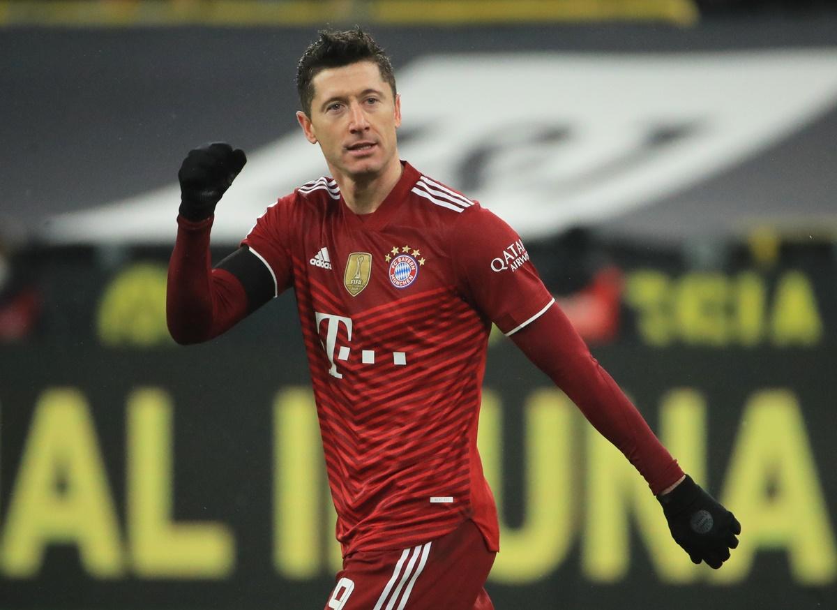 Robert Lewandowski celebrates scoring Bayern Munich's third goal in the Bundesliga match against Borussia Dortmund at Signal Iduna Park, Dortmund, on Saturday. 