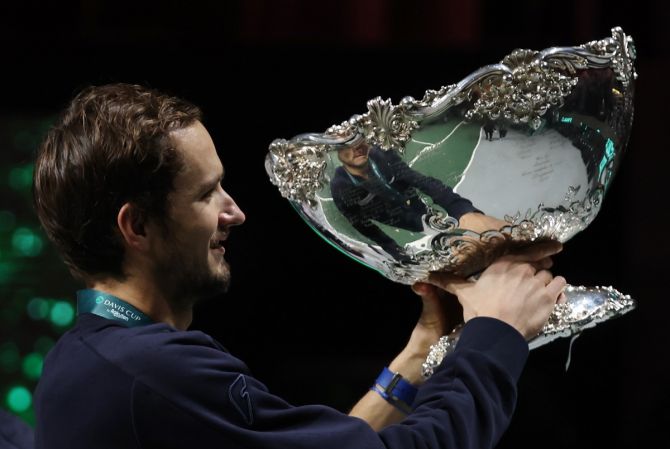 The Russian Tennis Federation's Daniil Medvedev hoists the Trophy.
