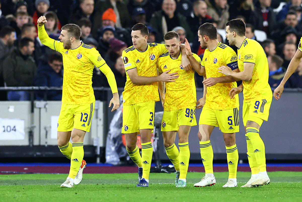 Dinamo Zagreb's Mislav Orsic celebrates with teammates on scoring their first goal against West Ham United in their Europa League Group H match at London Stadium, London.