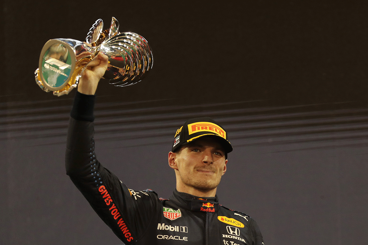 Red Bull's Max Verstappen celebrates winning the race and the world championship. Photograph: Kamran Jebreili/Pool via Reuters