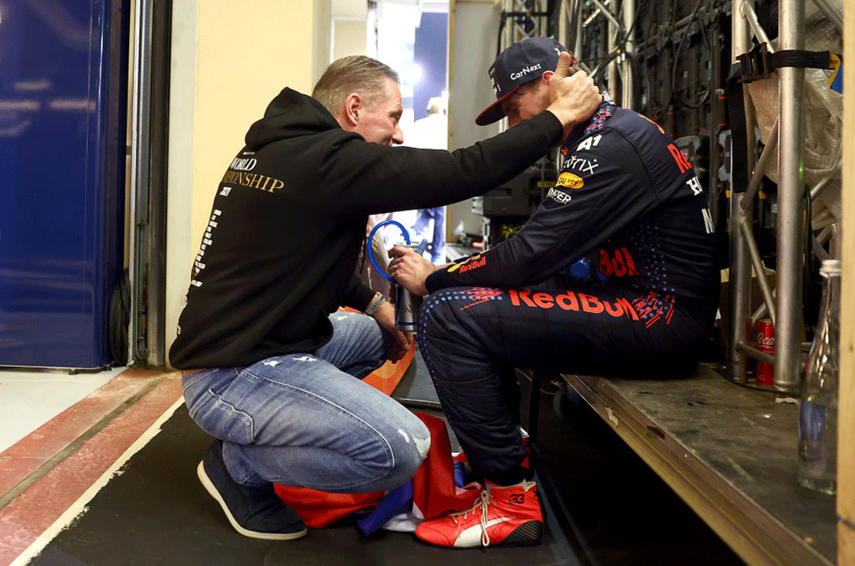 Race winner and 2021 F1 World Drivers Champion, Red Bull Racing's Max Verstappen celebrates with his father Jos Verstappen in parc ferme during the Abu Dhabi F1 Grand Prix at Yas Marina Circuit in Abu Dhabi on Sunday.