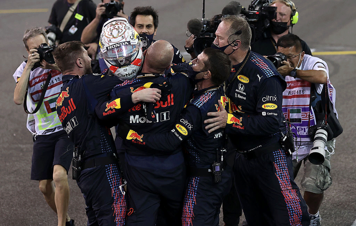 Race winner and 2021 F1 World Drivers Champion, Red Bull Racing's Max Verstappen celebrates with his team in parc ferme during the F1 Grand Prix of Abu Dhabi at Yas Marina Circuit in Abu Dhabi on Sunday