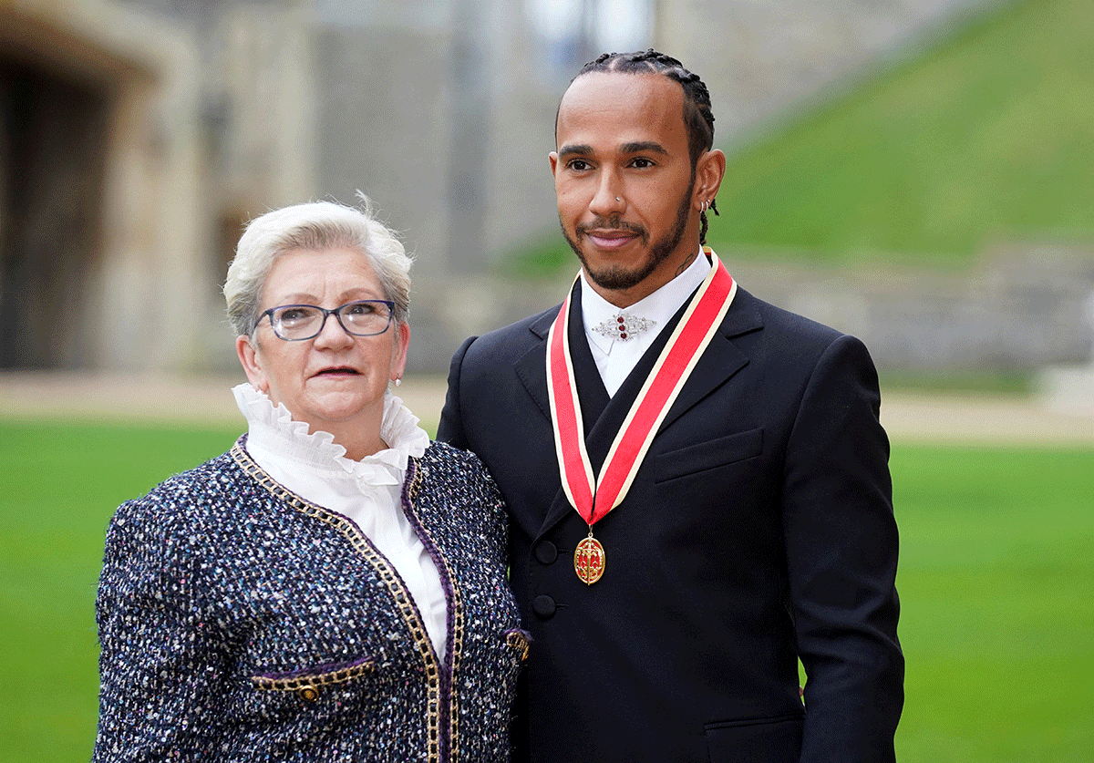 Lewis Hamilton poses with his mother Carmen Lockhart following his knighthood on Wednesday