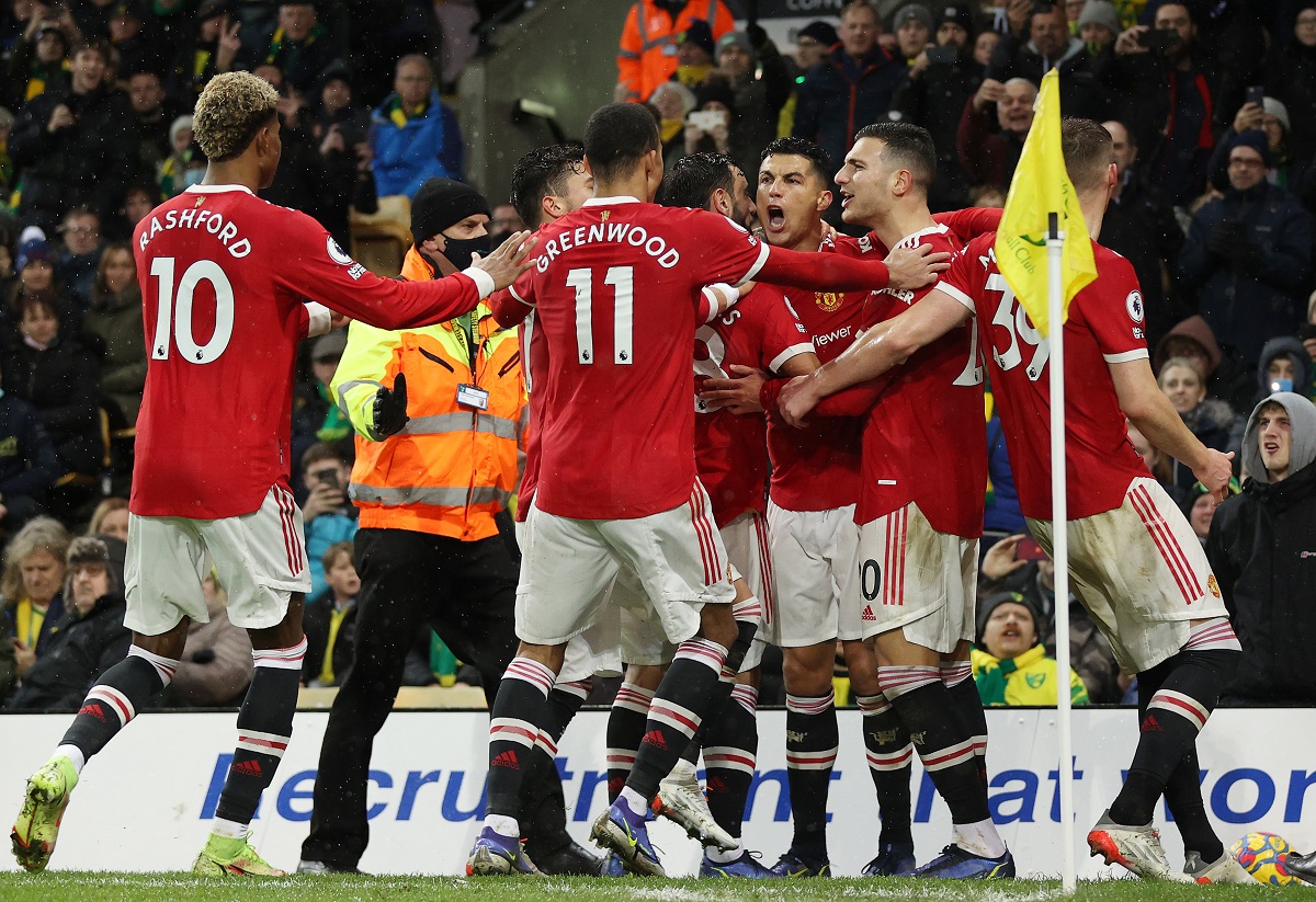 Manchester United players celebrate Cristiano Ronaldo's goal against Norwich