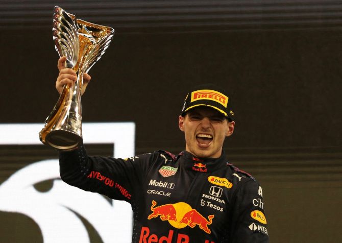 Red Bull's Max Verstappen celebrates with the world title.