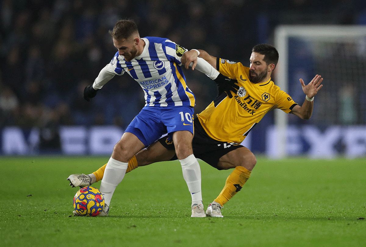 Brighton & Hove Albion's Alexis Mac Allister challenges Wolverhampton Wanderers' Joao Moutinho