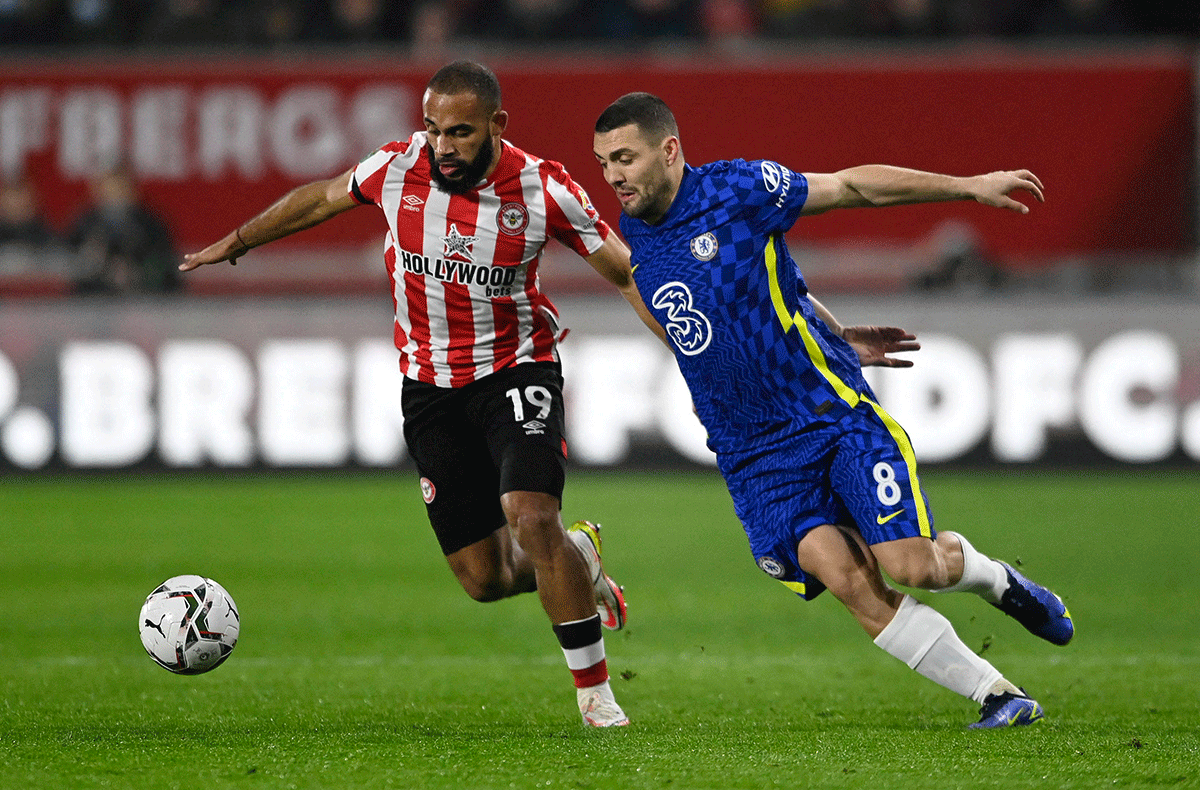 Brentford's Bryan Mbeumo in action with Chelsea's Mateo Kovacic during the League Cup quarter-final at Brentford Community Stadium in London on Wednesday 