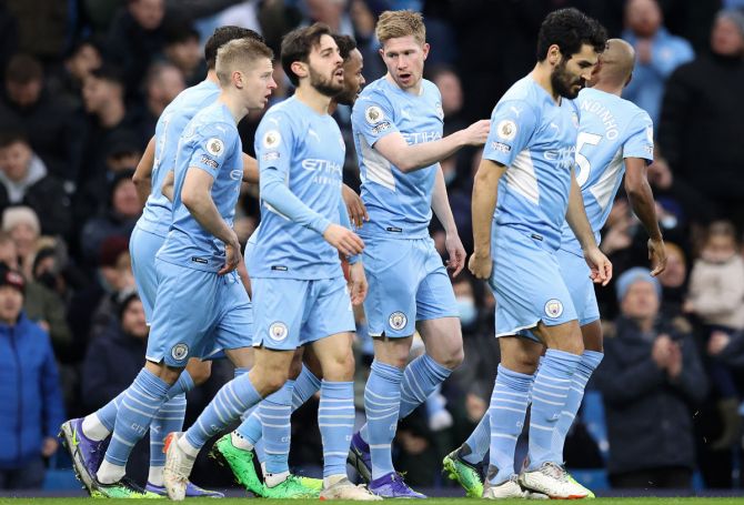 Kevin De Bruyne celebrates with Bernardo Silva, Ilkay Guendogan and teammates after scoring  Manchester City's first goal during the Premier League match against Leicester City, at Etihad Stadium on Sunday.  Alex Pantling/Getty Images