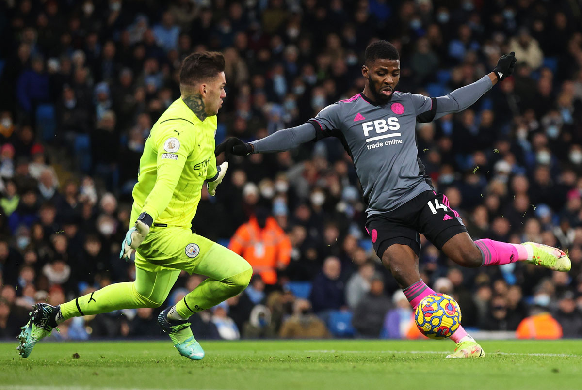 Kelechi Iheanacho scores Leicester City's third goal past Manchester City's Ederson.