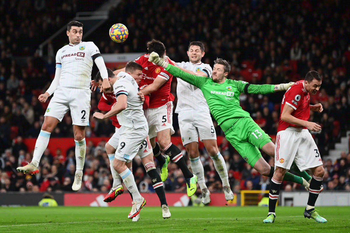 Burnley's Wayne Hennessey clears the ball to deny Manchester United's Harry Maguire