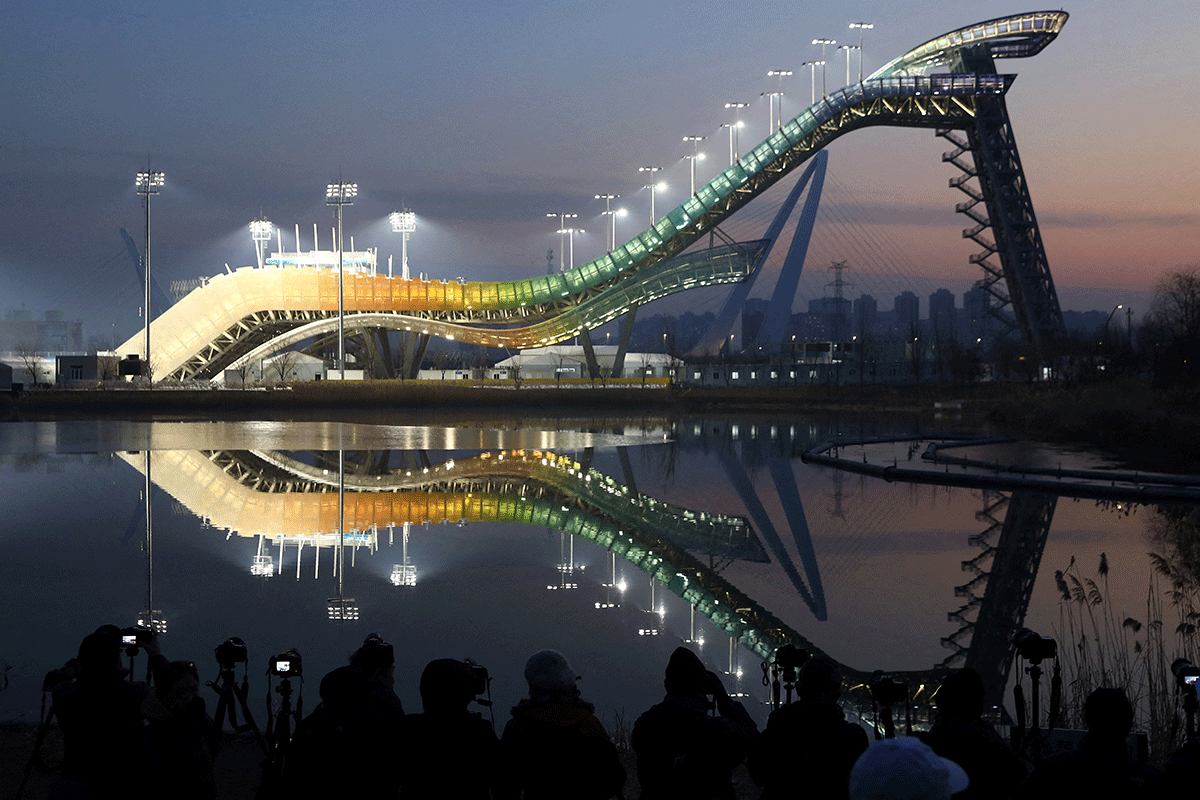 Big Air Shougang, a competition venue for freestyle skiing and snowboard during the Beijing 2022 Winter Olympics, is lit at dusk during an organised media tour, in Beijing, China December 15, 2021