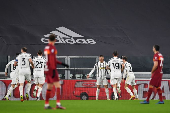 Cristiano Ronaldo celebrates with teammates after scoring Juventus's opening goal in the Serie A match against AS Roma, at Allianz Stadium in Turin, Italy, on Saturday.