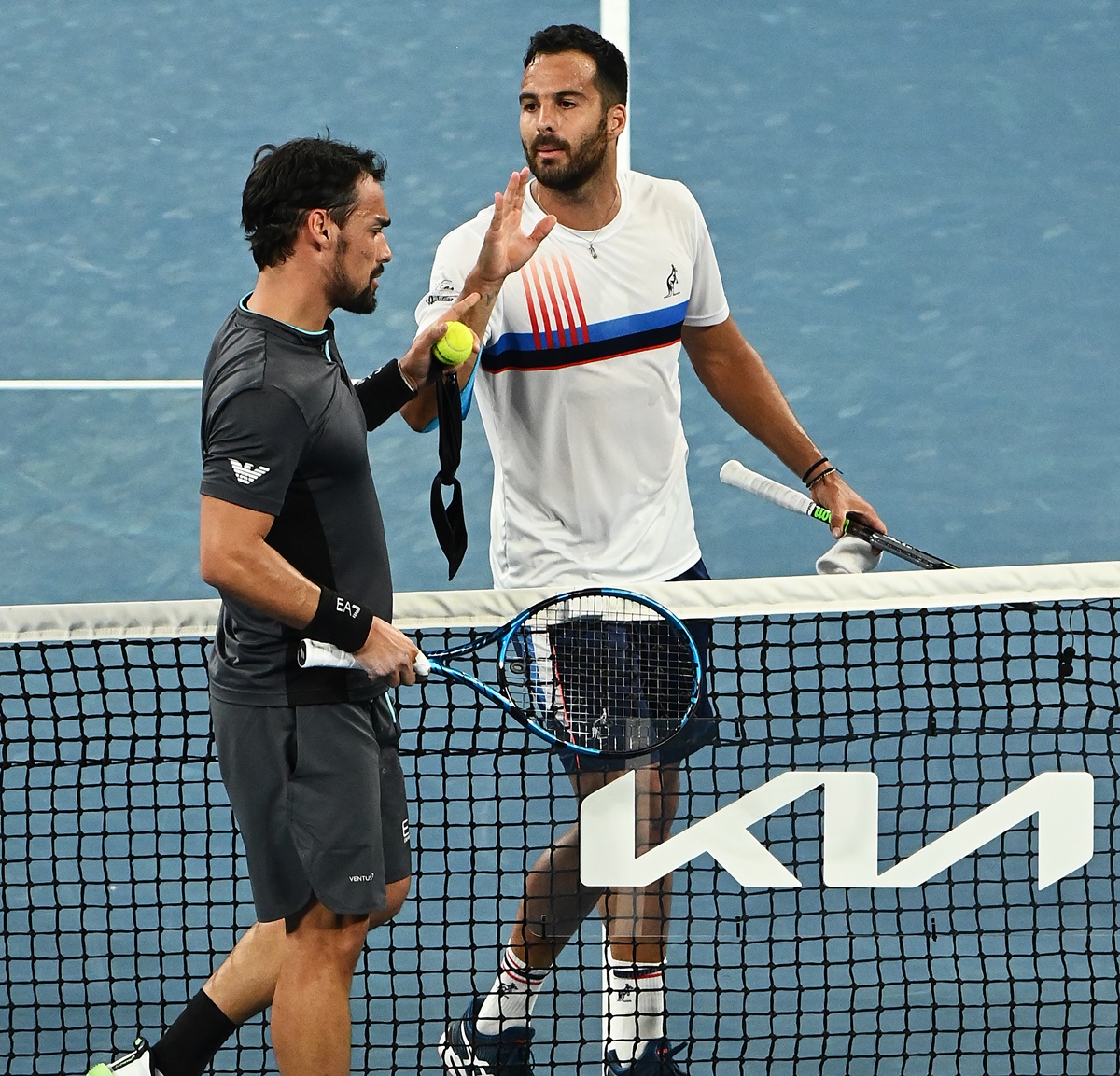 Italy's Fabio Fognini and Salvatore Caruso exchange words following their men's singles second round match on Day 4 of the Australian Open