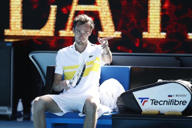 Russia's Daniil Medvedev celebrates victory as he sits down following his third round match against Serbia's Filip Krajinovic.