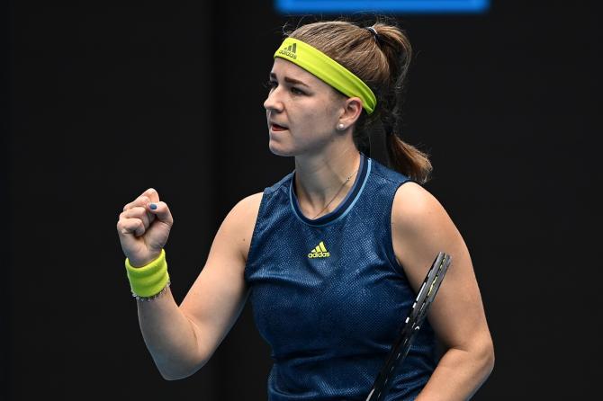 Karolina Muchova celebrates after winning a point against Karolina Pliskova.