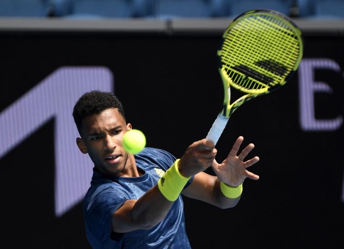 Canada's Felix Auger Aliassime in action during his fourth round match against Russia's Aslan Karatsev. 