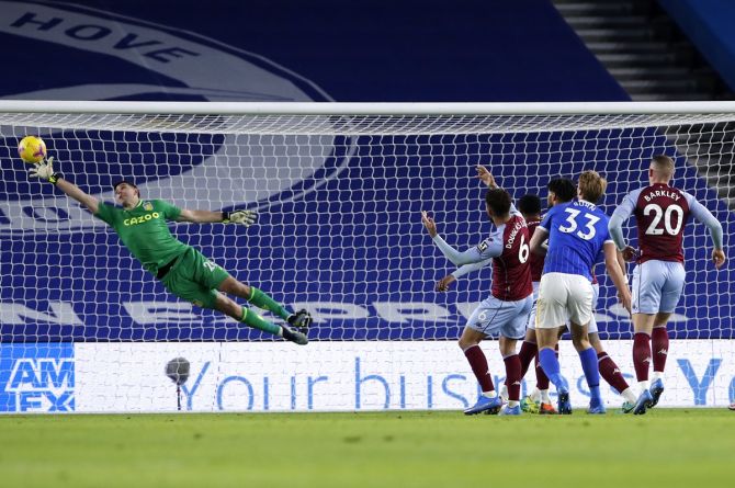 Aston Villa goalkeeper Emiliano Martinez pulls off brilliant save during the Premier League match against Brighton & Hove Albion, at American Express Community Stadium.