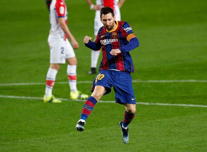 Lionel Messi celebrates scoring Barcelona's second goal against Alaves, at the Camp Nou, Barcelona, on Saturday.