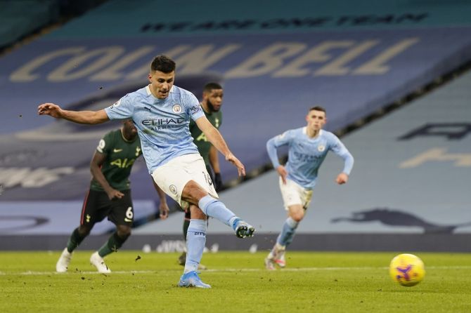 Rodrigo scores Manchester City's first goal from the penalty spot during the Premier League match against Tottenham Hotspur