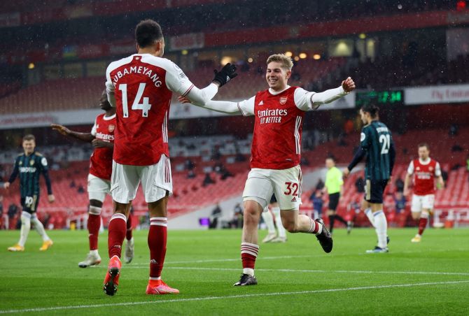 Pierre-Emerick Aubameyang celebrates scoring Arsenal's fourth goal with teammate Emile Smith