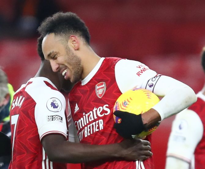 Arsenal's Pierre-Emerick Aubameyang celebrates with the match ball after scoring a hat-trick against Leeds United in the Premier League match at Emirates Stadium