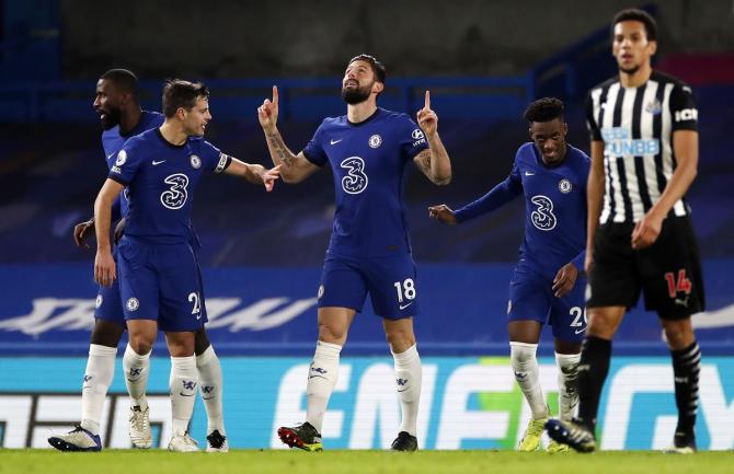 Olivier Giroud celebrates with Cesar Azpilicueta, left, after putting Chelsea ahead Newcastle United.