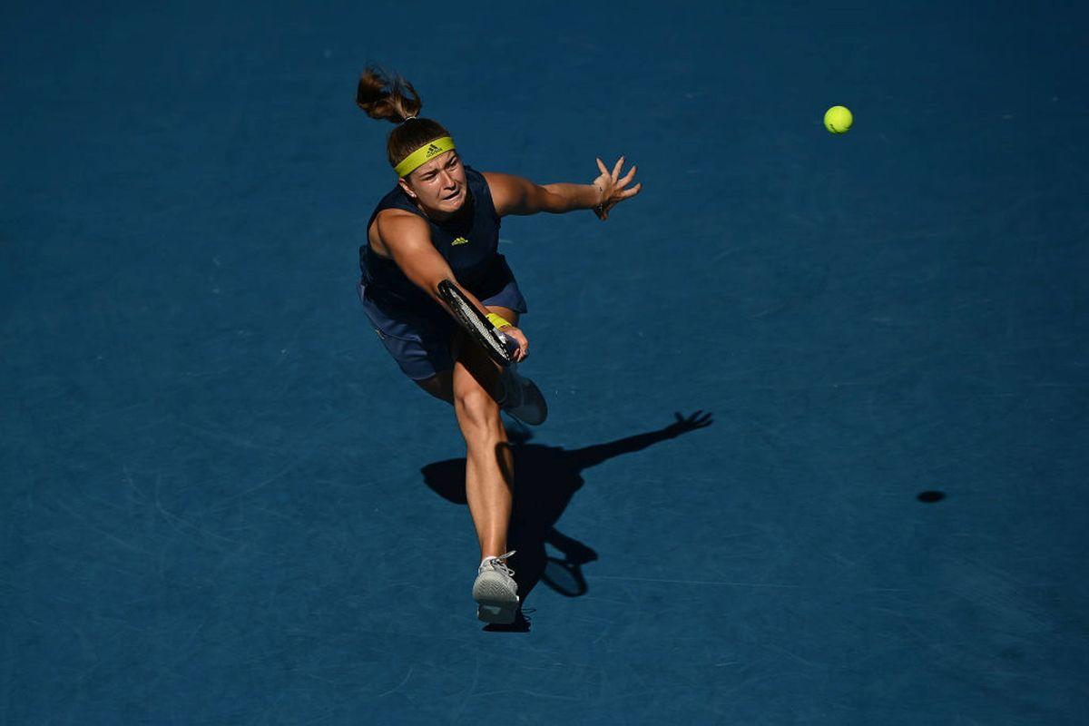 Czech Republi's Karolina Muchova stretches to play a return against Jennifer Brady