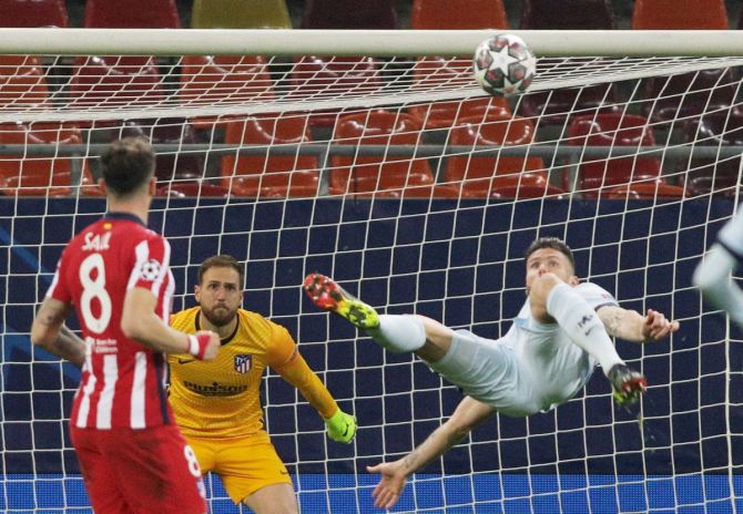 Chelsea's Olivier Giroud scores against Atletico in acrobatic fashion in their Champions League round of 16 first leg match Arena Nationala in Bucharest, Romania, on Tuesday. 