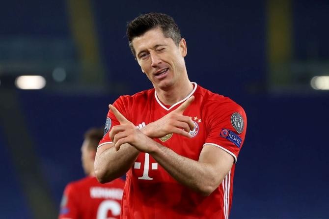 FC Bayern Munich's Robert Lewandowski celebrates on scoring the first goal against Lazio Roma during their UEFA Champions League Round of 16 match at Olimpico Stadium in Rome