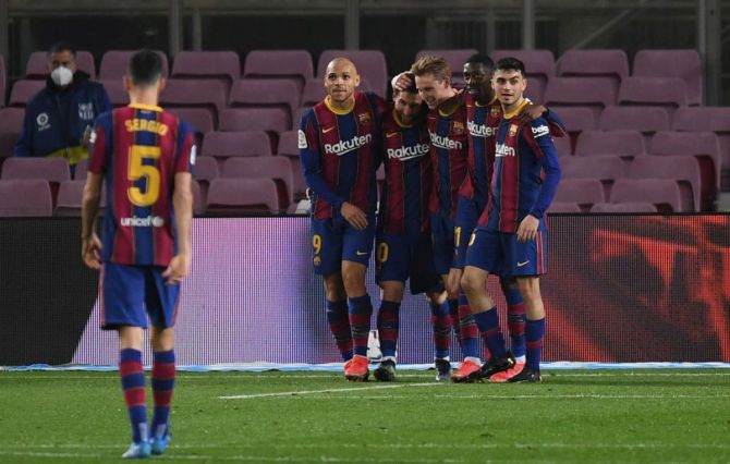 FC Barcelona's Lionel Messi celebrates with team mates after scoring the second goal against Elche CF during the La Liga Santader match at Camp Nou in Barcelona on Wednesday